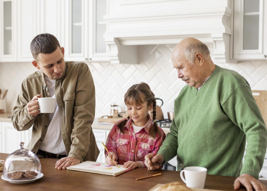 4 Wonderful Ways of Involving Grandparents in Toddler Finance Literacy: Building Intergenerational Money Wisdom 2 medium shot men watching girl Involving grandparents in toddler finance literacy,
Grandparent toddler financial education India,
Intergenerational money learning for toddlers,
Family financial wisdom across generations,
Grandparent teaching money to young children,