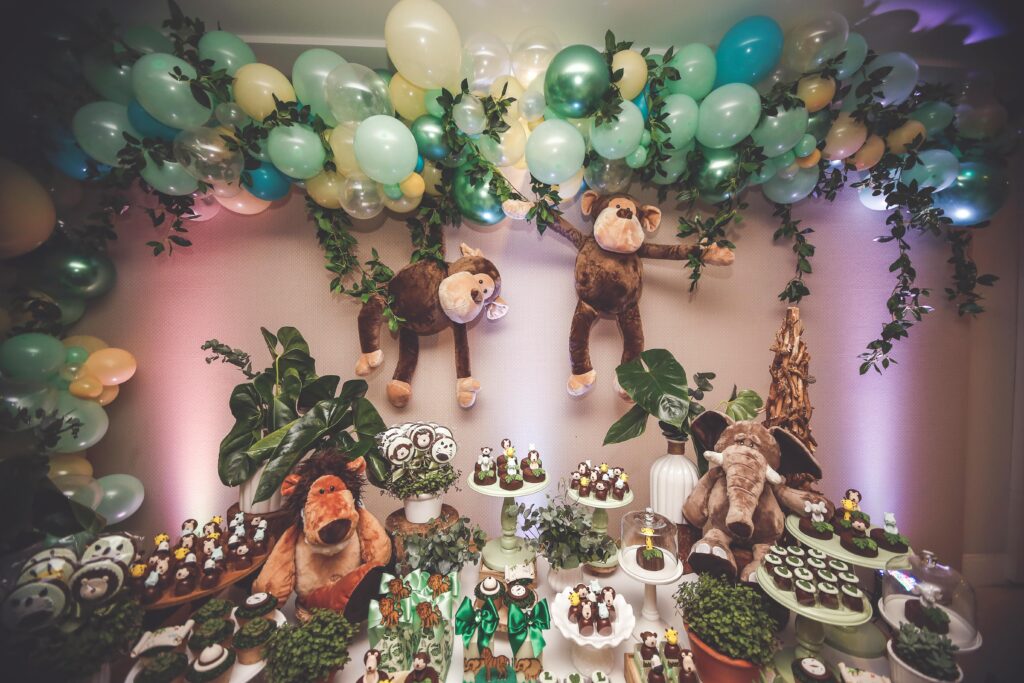 15 Smart Birthday Gift Management Strategies That Save You 50000 Rupees Annually Through Gratitude 4 pexels photo 2337859 2337859 Jungle-themed dessert table with plush animals, balloons, and cupcakes for a festive celebration.